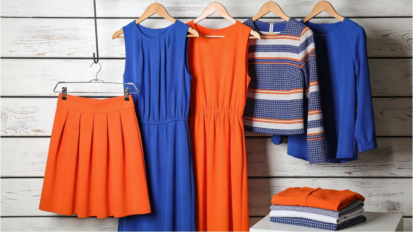 Women's dresses and skirts displayed in a clean modern arrangement