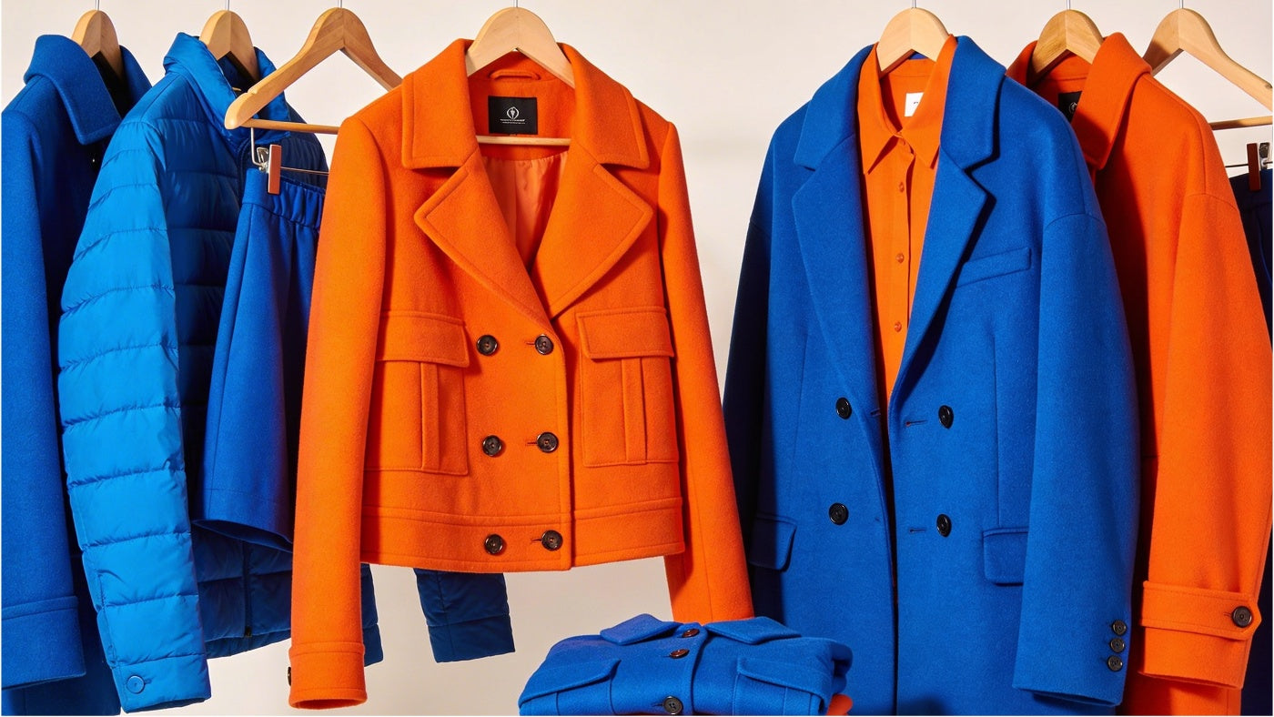 Women's jackets and outerwear displayed in a clean modern arrangement