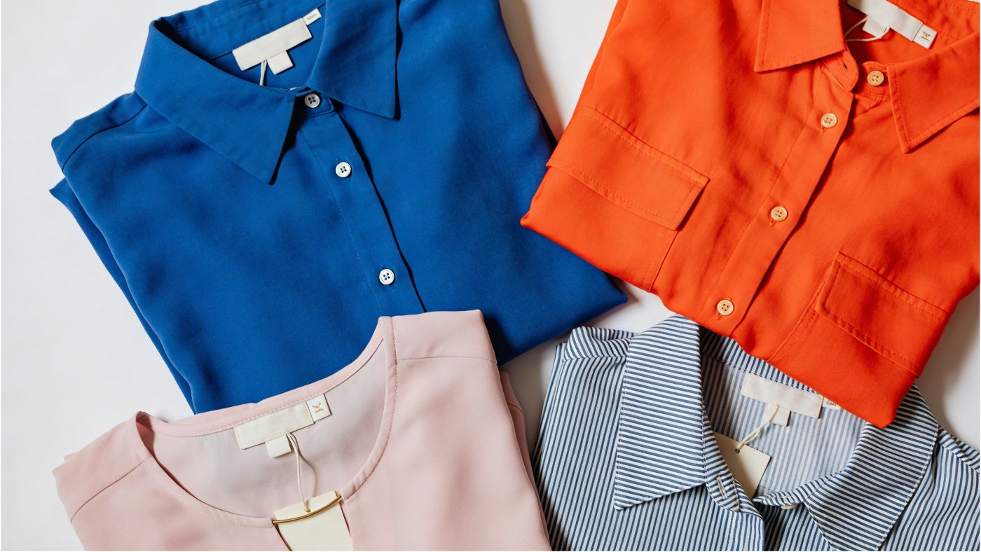 Women's tops including shirts and blouses displayed in a clean organized layout